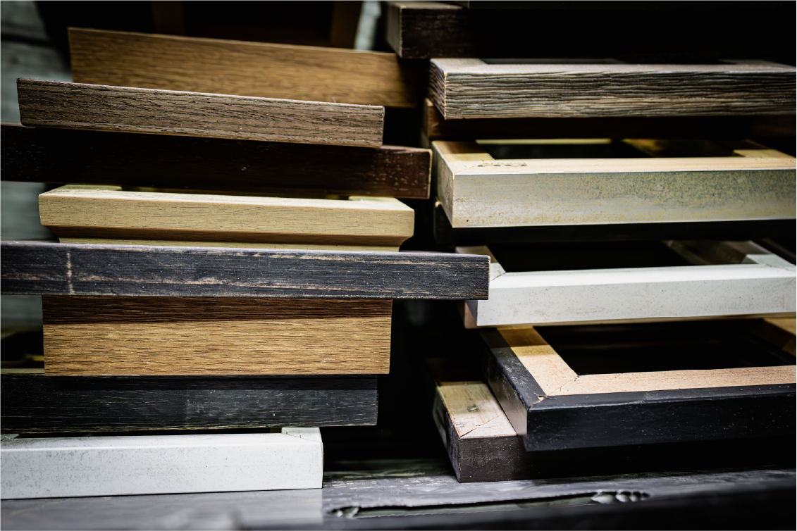 Stacked wood samples mixed finishes indoor workshop lighting